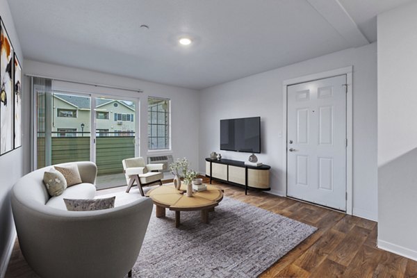 Modern living room with chic furnishings at Trillium Apartments, showcasing luxury and comfort in a stylish setting