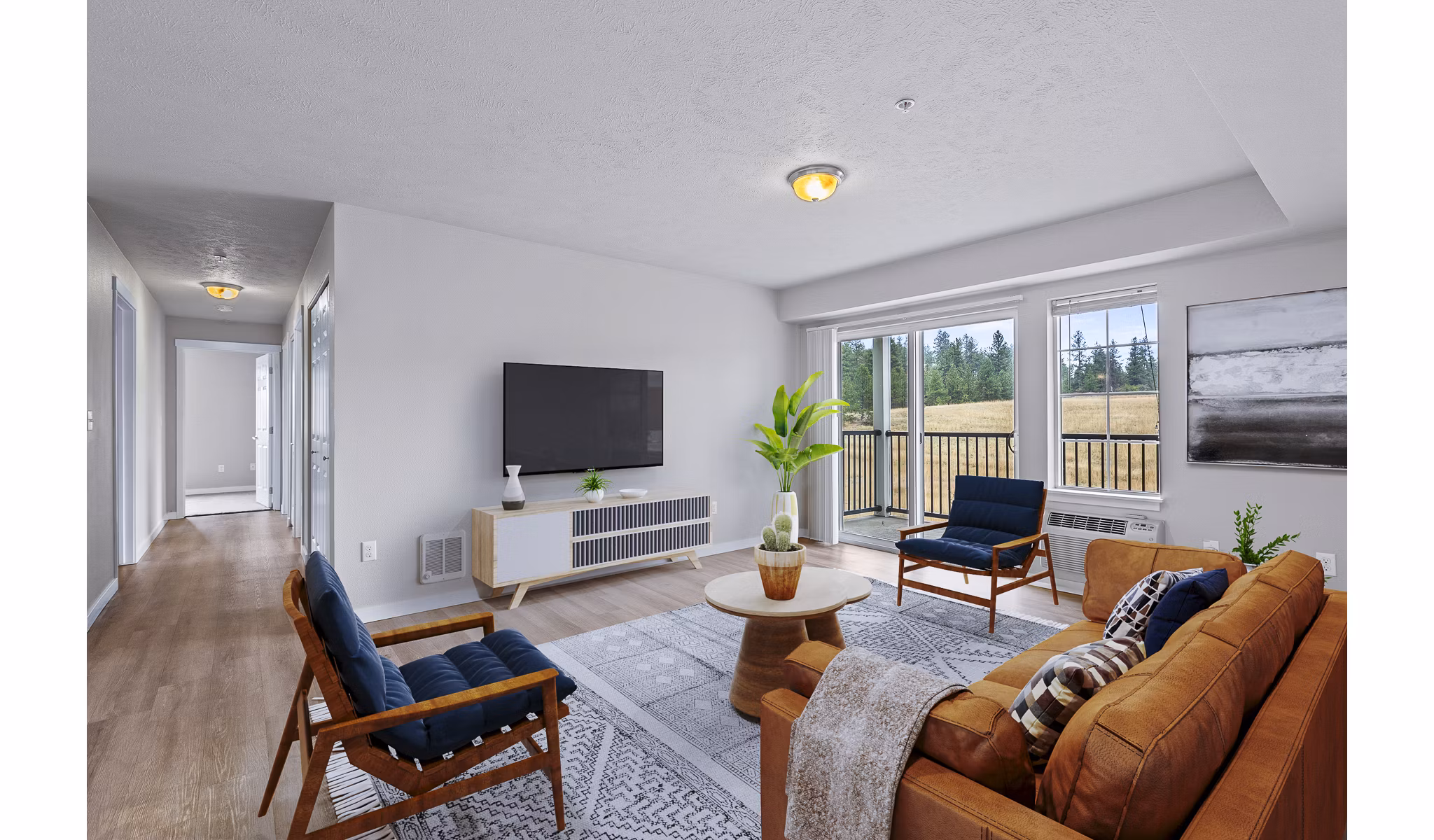 Living room with modern decor and vibrant accents in Trillium Apartments