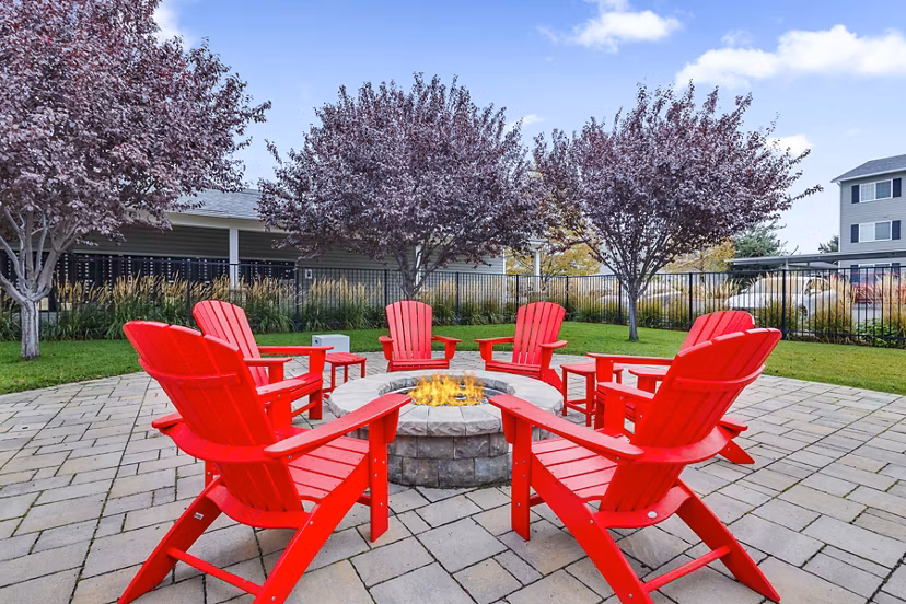 Cozy outdoor patio with fire pit at Trillium Apartments