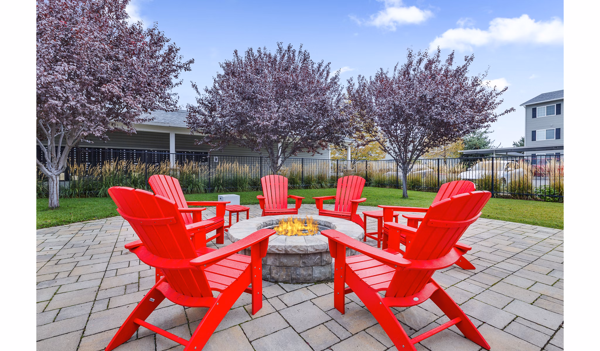 Cozy outdoor patio with fire pit at Trillium Apartments