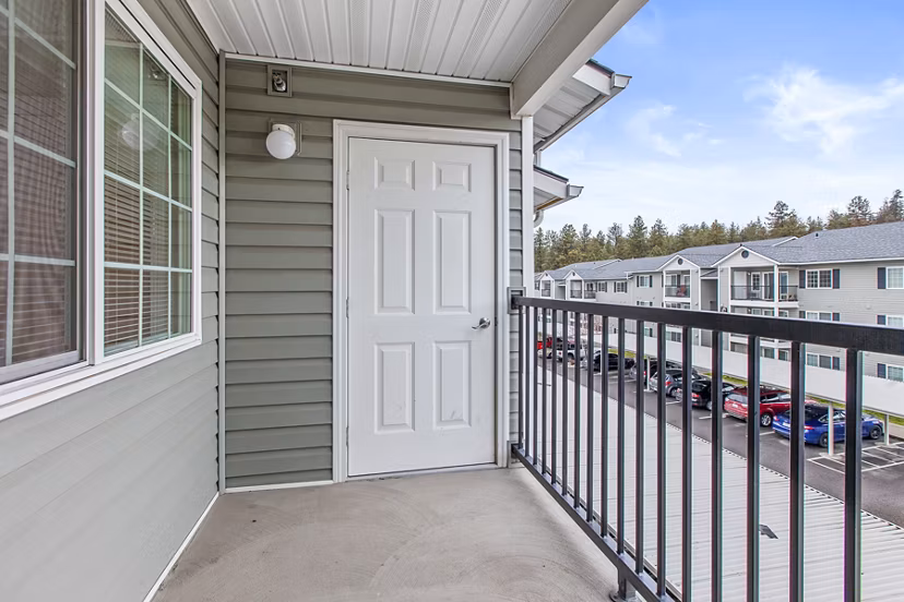 Cozy patio with modern seating at Trillium Apartments