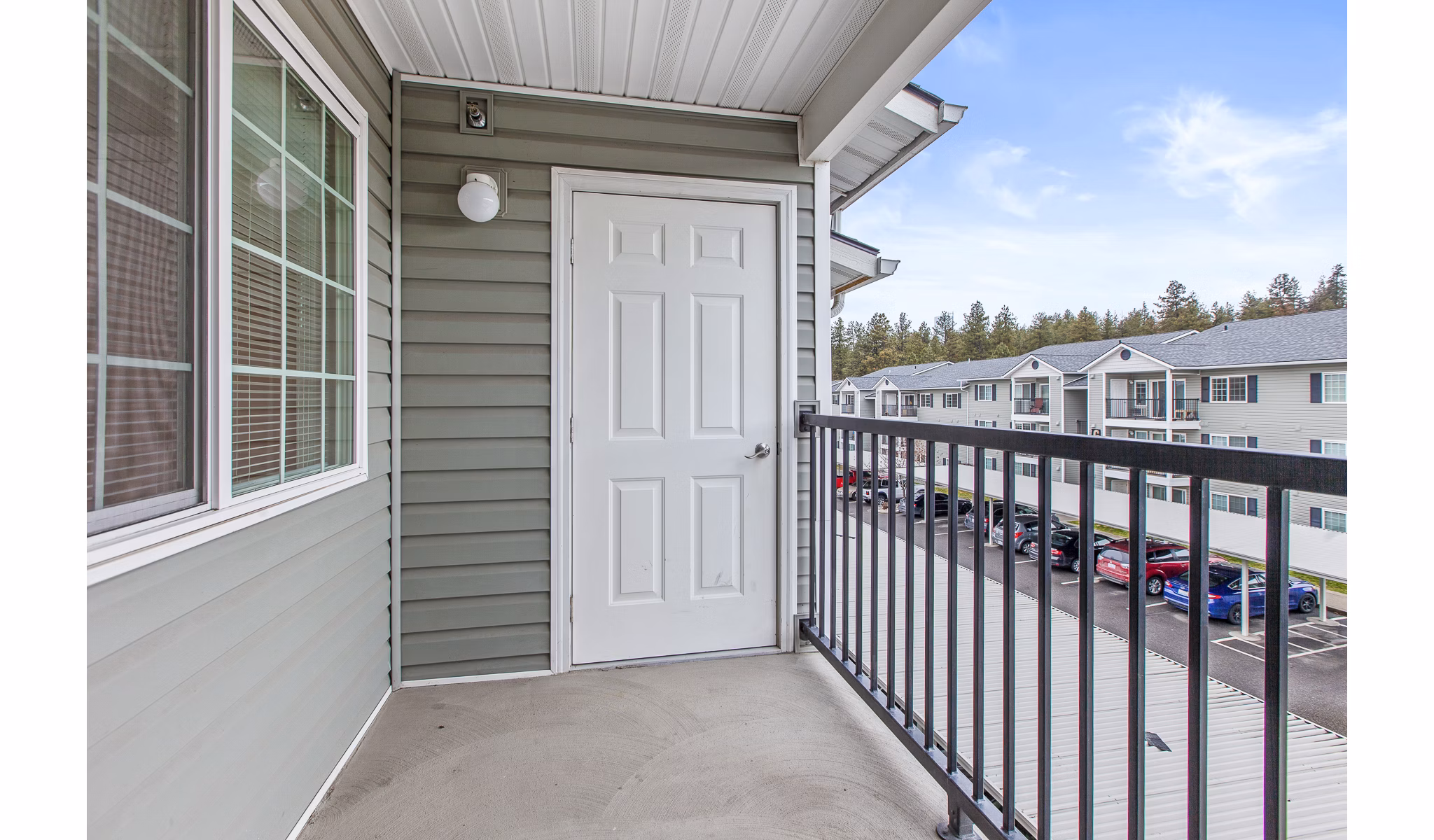 Cozy patio with modern seating at Trillium Apartments