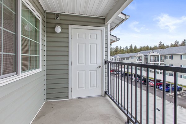 Cozy patio with modern seating at Trillium Apartments