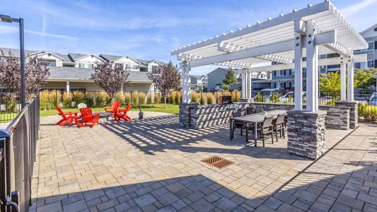 Spacious outdoor grill area and patio at Trillium Apartments, perfect for entertaining and relaxation