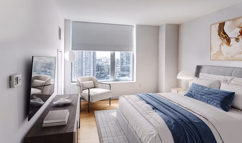 Elegant bedroom featuring modern decor and large windows in Radian Apartments A luxury experience in urban living