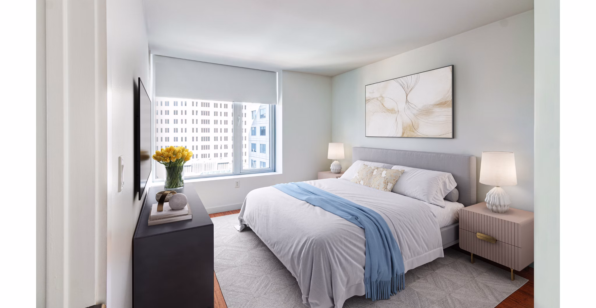 Modern bedroom with large windows and stylish decor at Radian Apartments, offering luxury living in a prime location