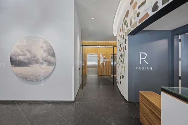Lobby with modern decor and seating at Radian Apartments