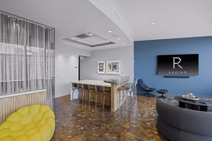 Modern lobby featuring sleek design and comfortable seating at Radian Apartments