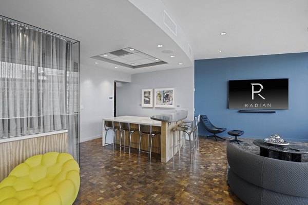 Modern lobby featuring sleek design and comfortable seating at Radian Apartments