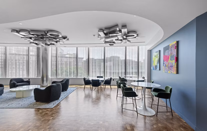 Modern dining room with elegant lighting and stylish furnishings at Radian Apartments in vibrant urban setting