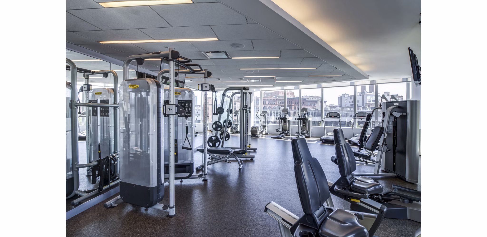 Fully-equipped fitness center with modern gym equipment at Radian Apartments Ideal for staying active and healthy in a luxurious setting