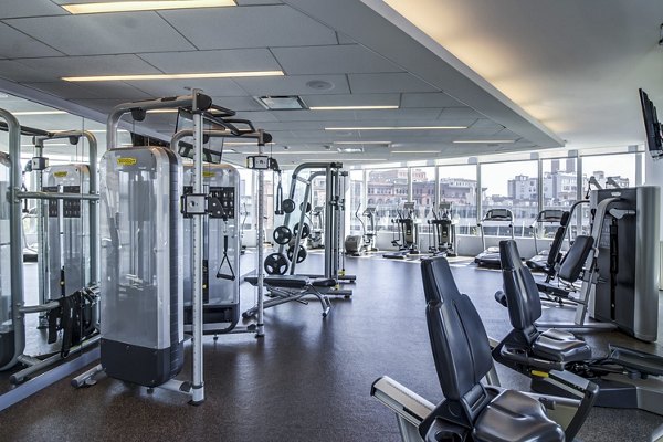 Fully-equipped fitness center with modern gym equipment at Radian Apartments Ideal for staying active and healthy in a luxurious setting