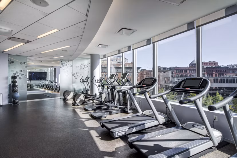 Modern fitness center with state-of-the-art equipment at Radian Apartments luxury living community