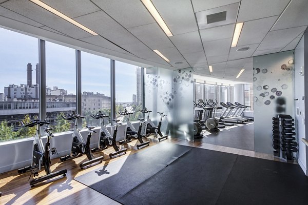 State-of-the-art fitness center with modern equipment at Radian Apartments