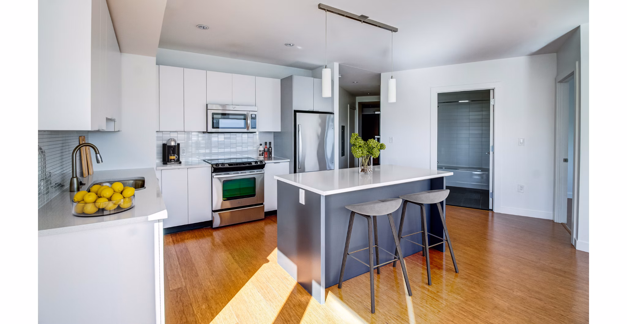 Modern kitchen with stainless steel appliances at Radian Apartments
