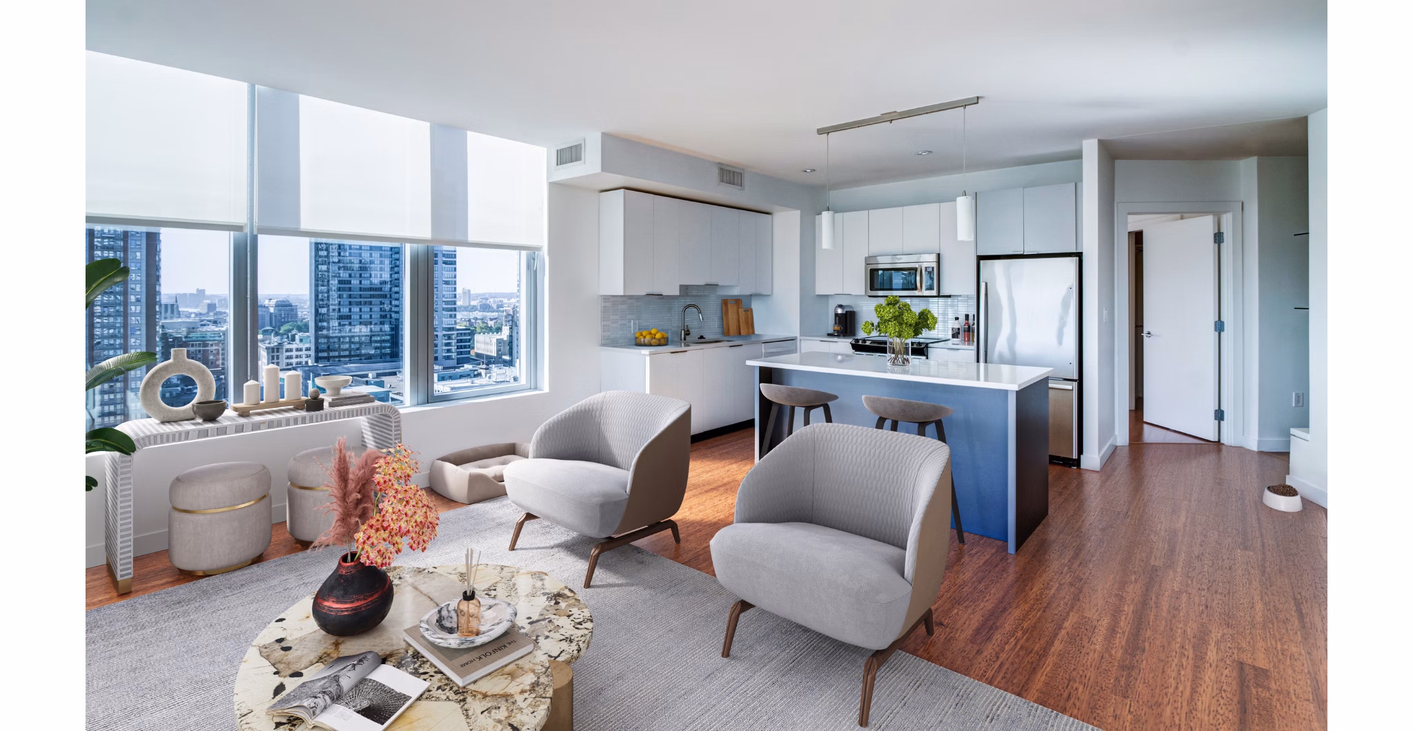 Spacious living room with modern furnishings and large windows in Radian Apartments, offering a luxurious lifestyle experience