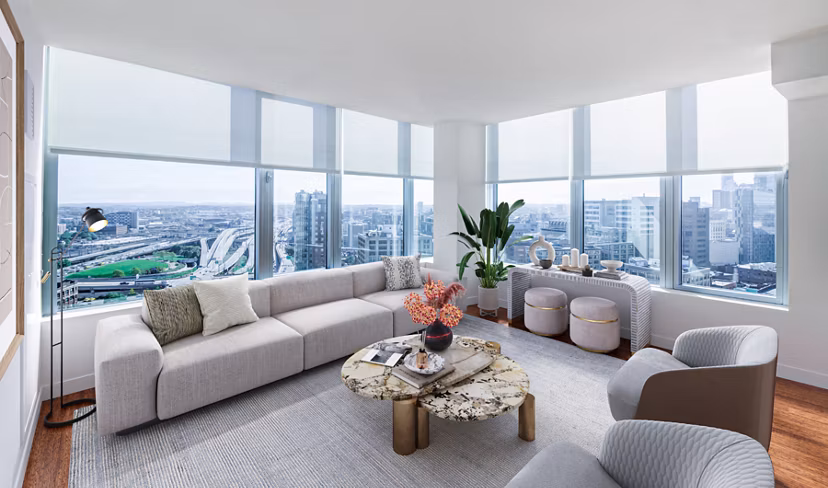 Spacious living room with modern furnishings in Radian Apartments