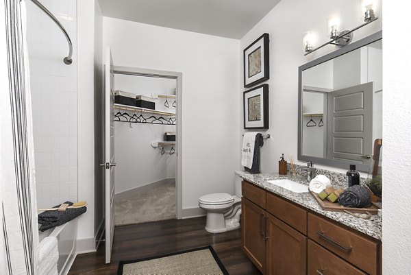 Luxury bathroom with modern fixtures at Austin Avenue Apartments