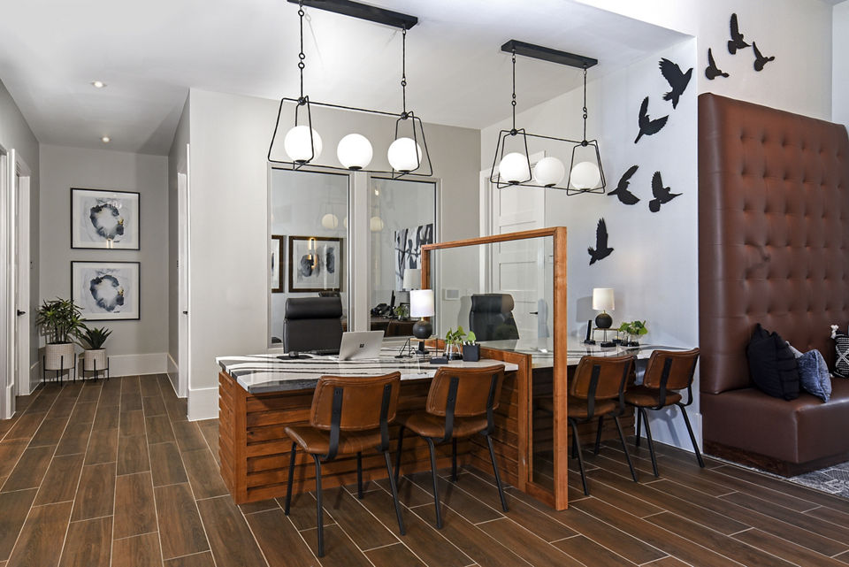 Clubhouse featuring modern decor and spacious seating at Austin Avenue Apartments