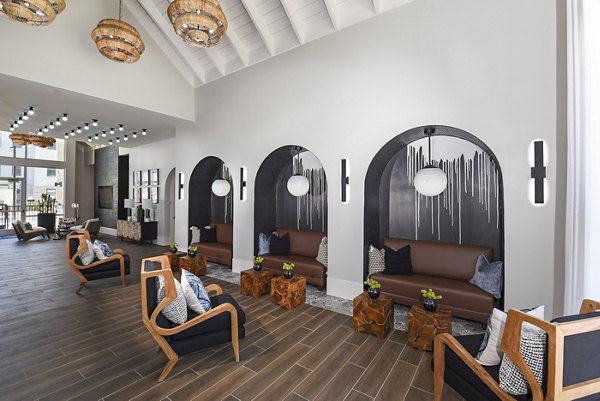 Clubhouse featuring modern design and cozy seating at Austin Avenue Apartments luxury complex