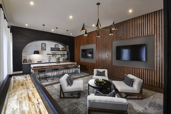 Clubhouse interior featuring contemporary design and comfortable seating at Austin Avenue Apartments