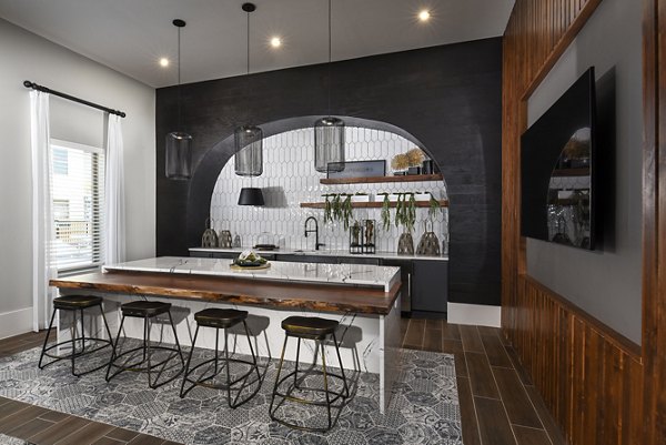 Clubhouse with modern dÃ©cor and seating at Austin Avenue Apartments: ideal for social gatherings and community events