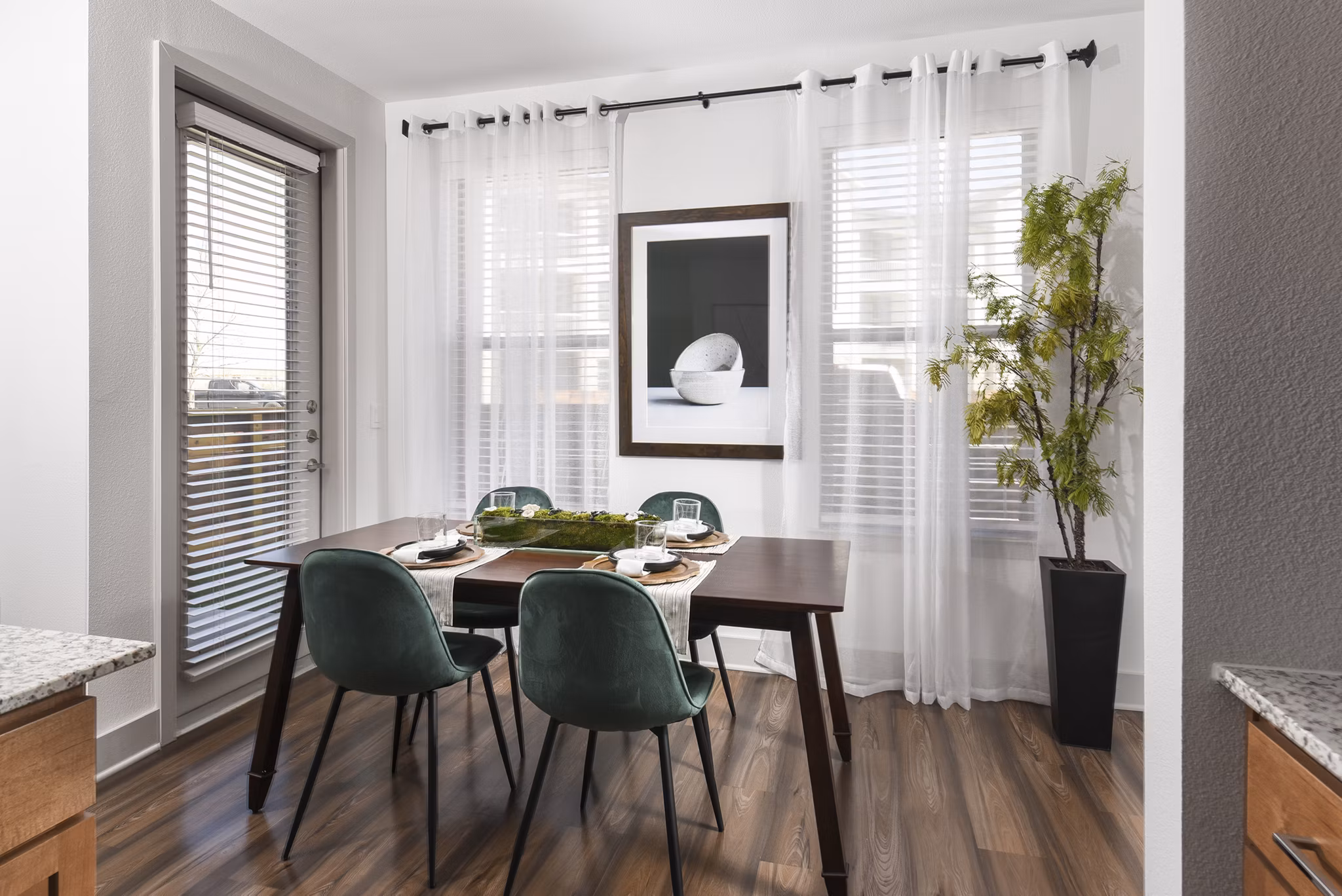 Dining area featuring modern furnishings and open layout at Austin Avenue Apartments