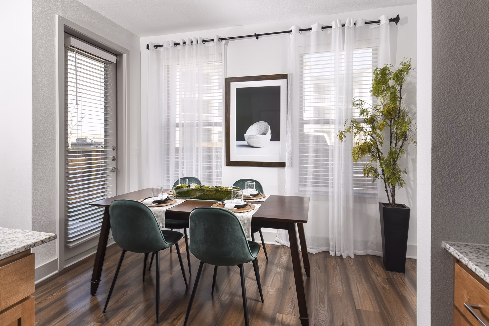 Dining area featuring modern furnishings and open layout at Austin Avenue Apartments