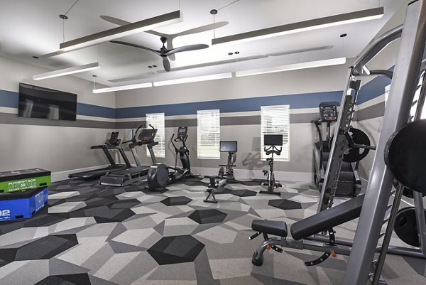 Well-equipped fitness center at Austin Avenue Apartments with modern equipment for residents' workout needs