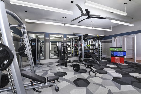 Fitness center with modern equipment at Austin Avenue Apartments for an active lifestyle
