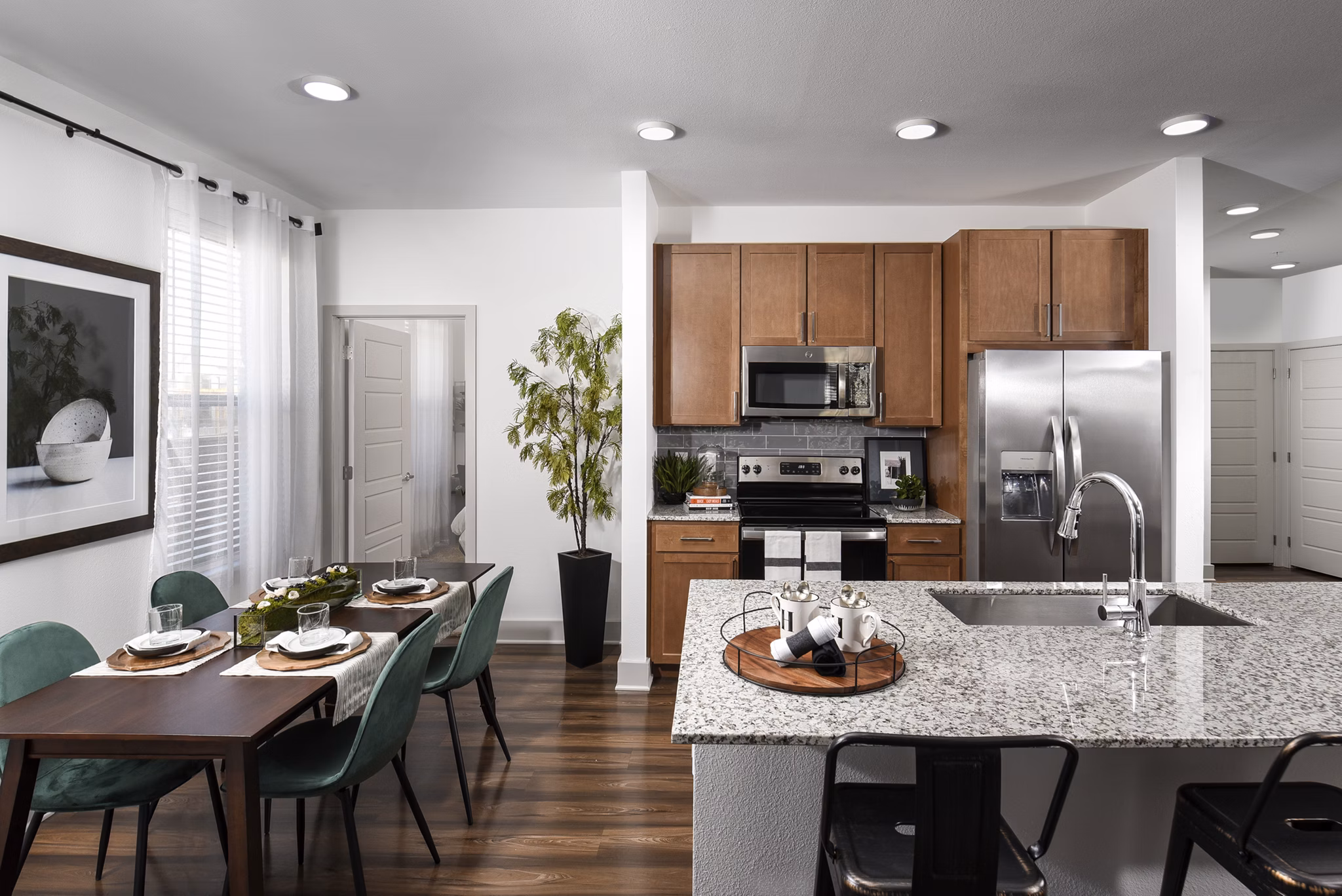 Modern kitchen with stainless steel appliances at Austin Avenue Apartments