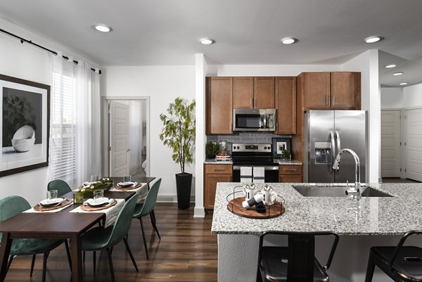 Modern kitchen with stainless steel appliances at Austin Avenue Apartments