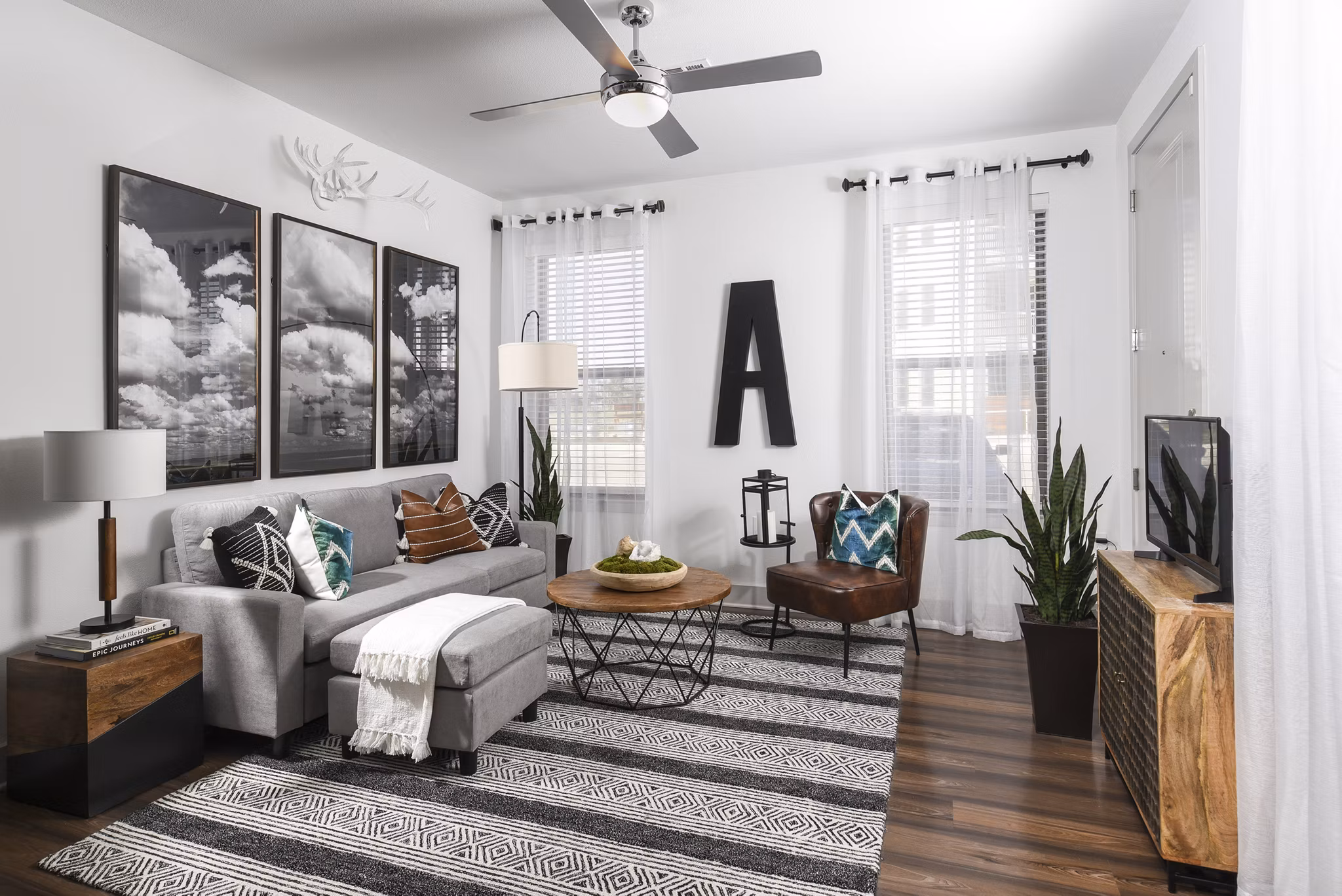 Modern living room with elegant furnishings at Austin Avenue Apartments in a vibrant Greystar community
