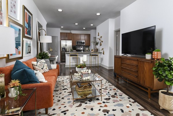 Living room with modern furnishings at Austin Avenue Apartments