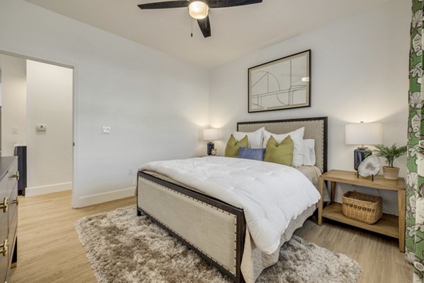 Modern bedroom with stylish dÃ©cor at The Banks at Rivergate Apartments, offering luxury living spaces for comfortable and elegant lifestyles