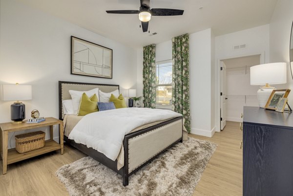 Modern bedroom with plush bedding and natural lighting at The Banks at Rivergate luxury apartments