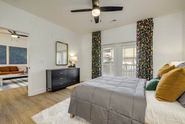Spacious bedroom with modern decor at The Banks at Rivergate Apartments