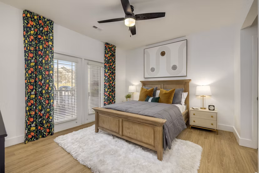 Cozy bedroom with modern decor at The Banks at Rivergate Apartments