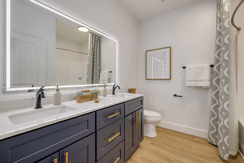 Modern bathroom with sleek fixtures at The Banks at Rivergate Apartments