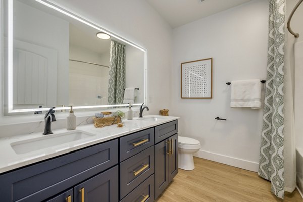 Modern bathroom with sleek fixtures at The Banks at Rivergate Apartments