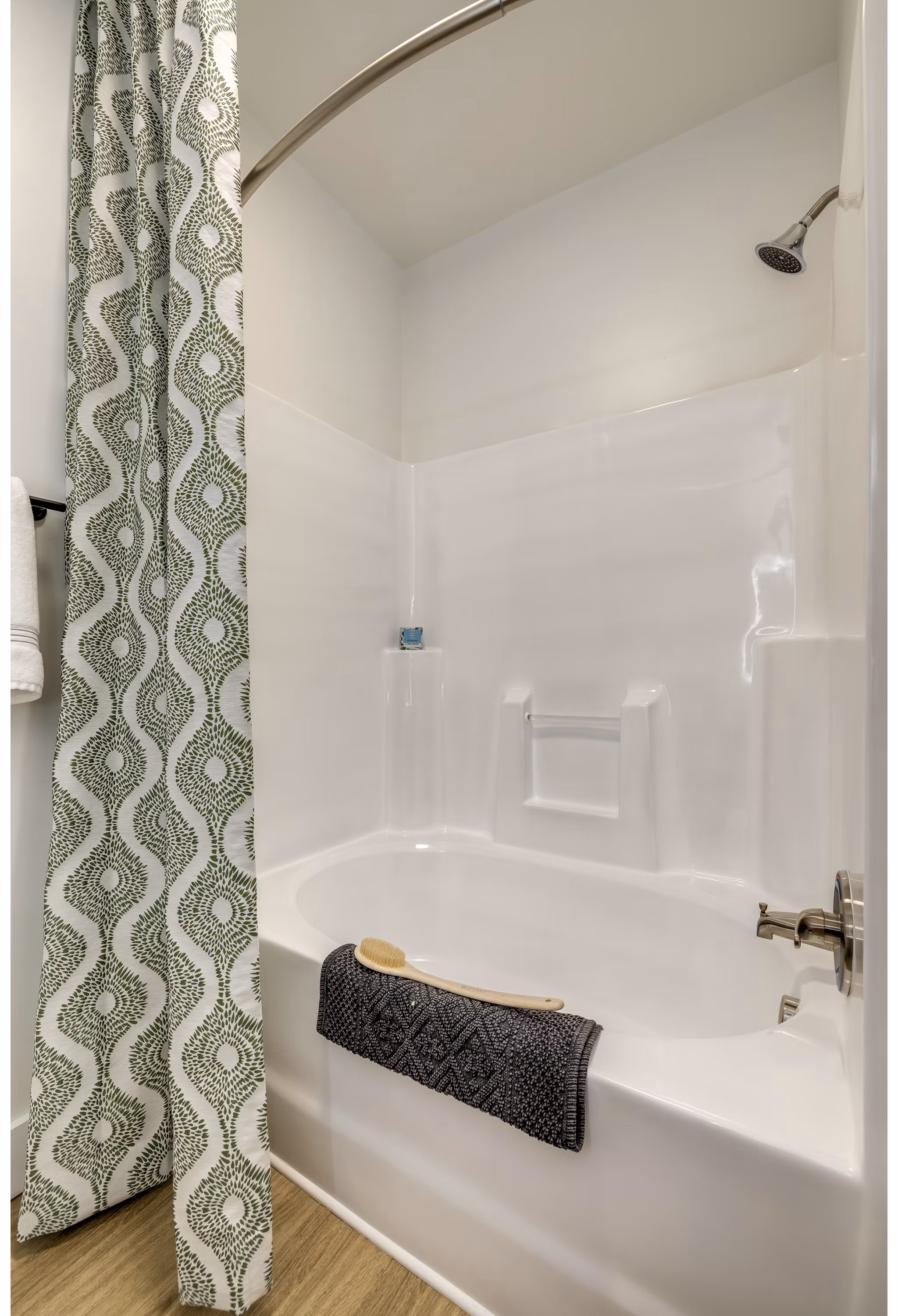 Modern bathroom featuring sleek fixtures and a glass-enclosed shower at The Banks at Rivergate Apartments