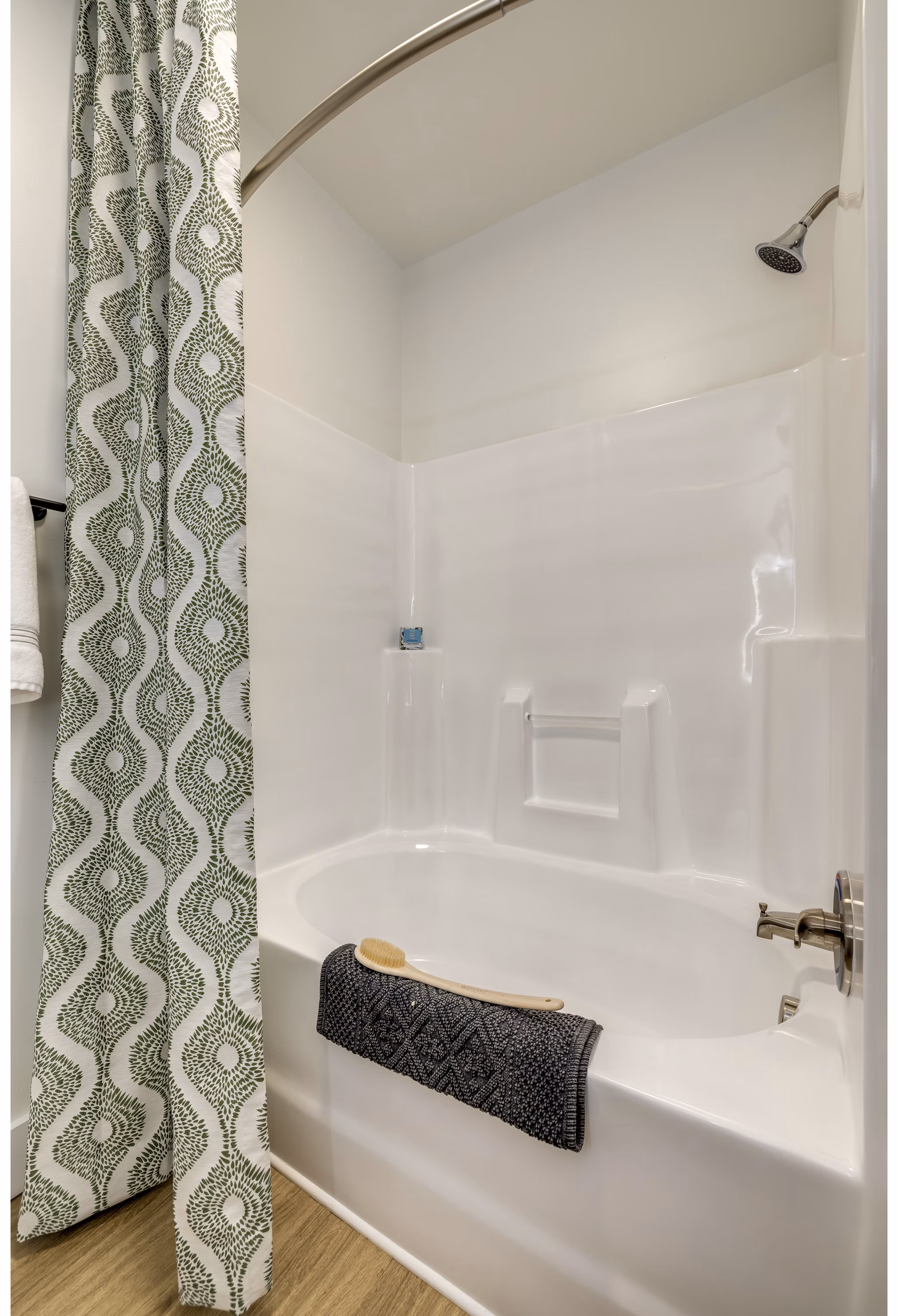 Modern bathroom featuring sleek fixtures and a glass-enclosed shower at The Banks at Rivergate Apartments
