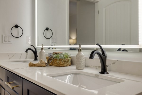 Modern bathroom with sleek finishes at The Banks at Rivergate Apartments