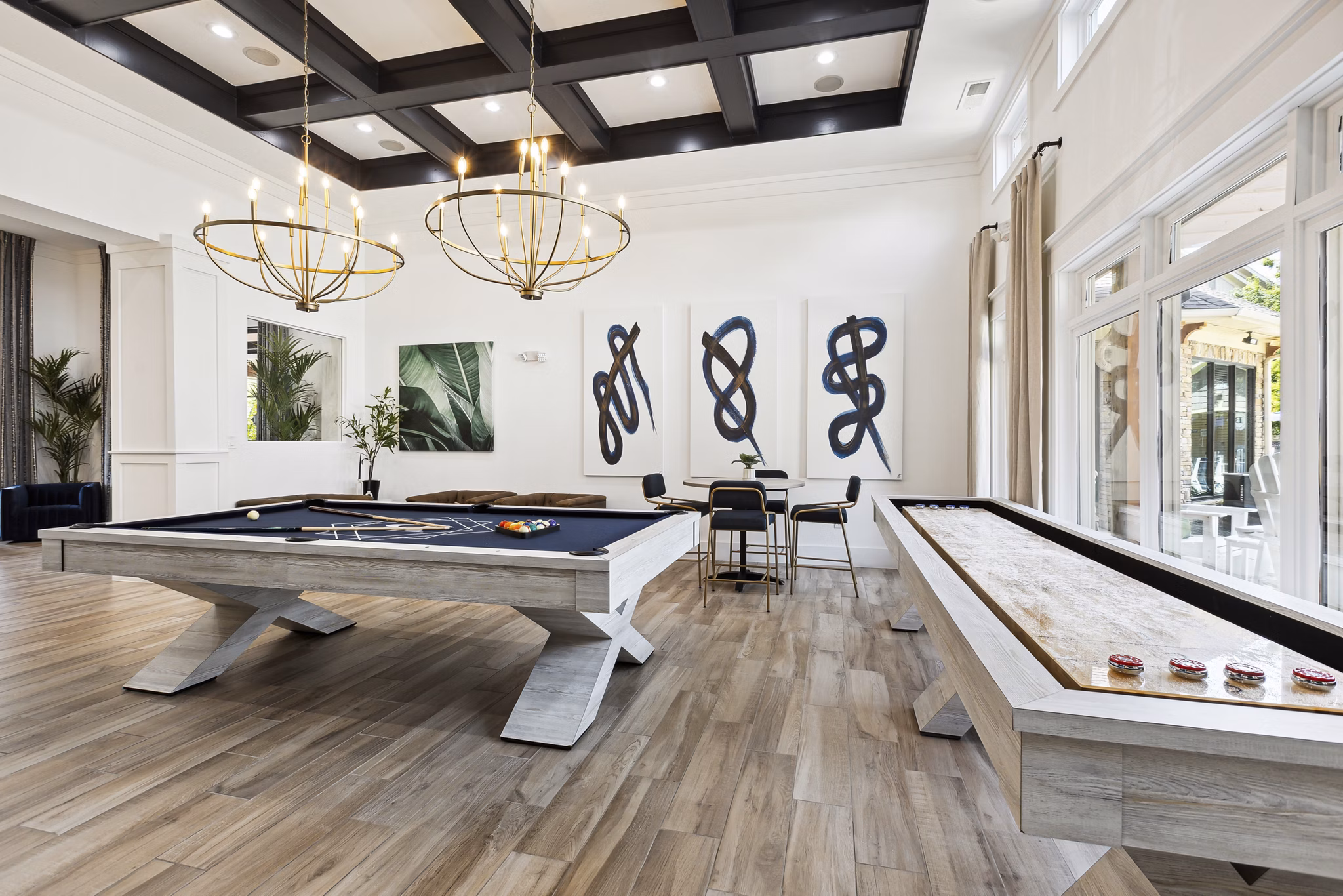 Game room with pool table and lounge seating at The Banks at Rivergate luxury apartments