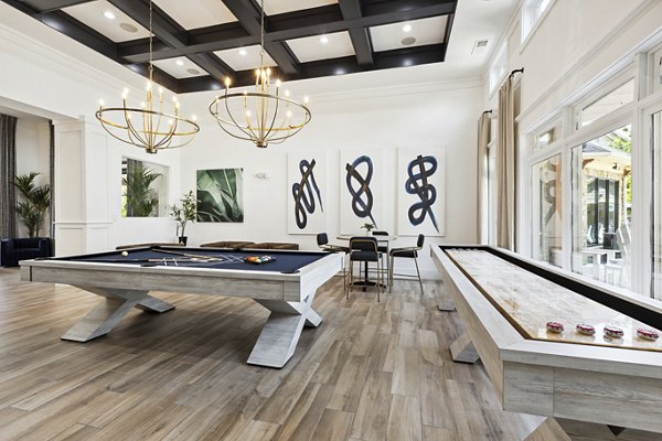 Game room with pool table and lounge seating at The Banks at Rivergate luxury apartments