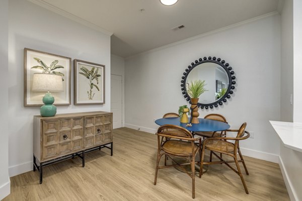 Dining area featuring elegant decor and modern appliances at The Banks at Rivergate Apartments, a luxury Greystar community