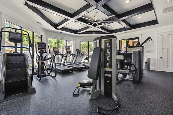 Modern fitness center with advanced equipment at The Banks at Rivergate Apartments