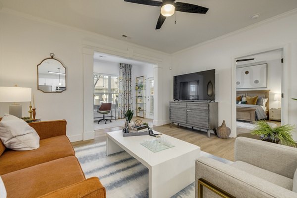 Spacious living room with contemporary furnishings at The Banks at Rivergate Apartments