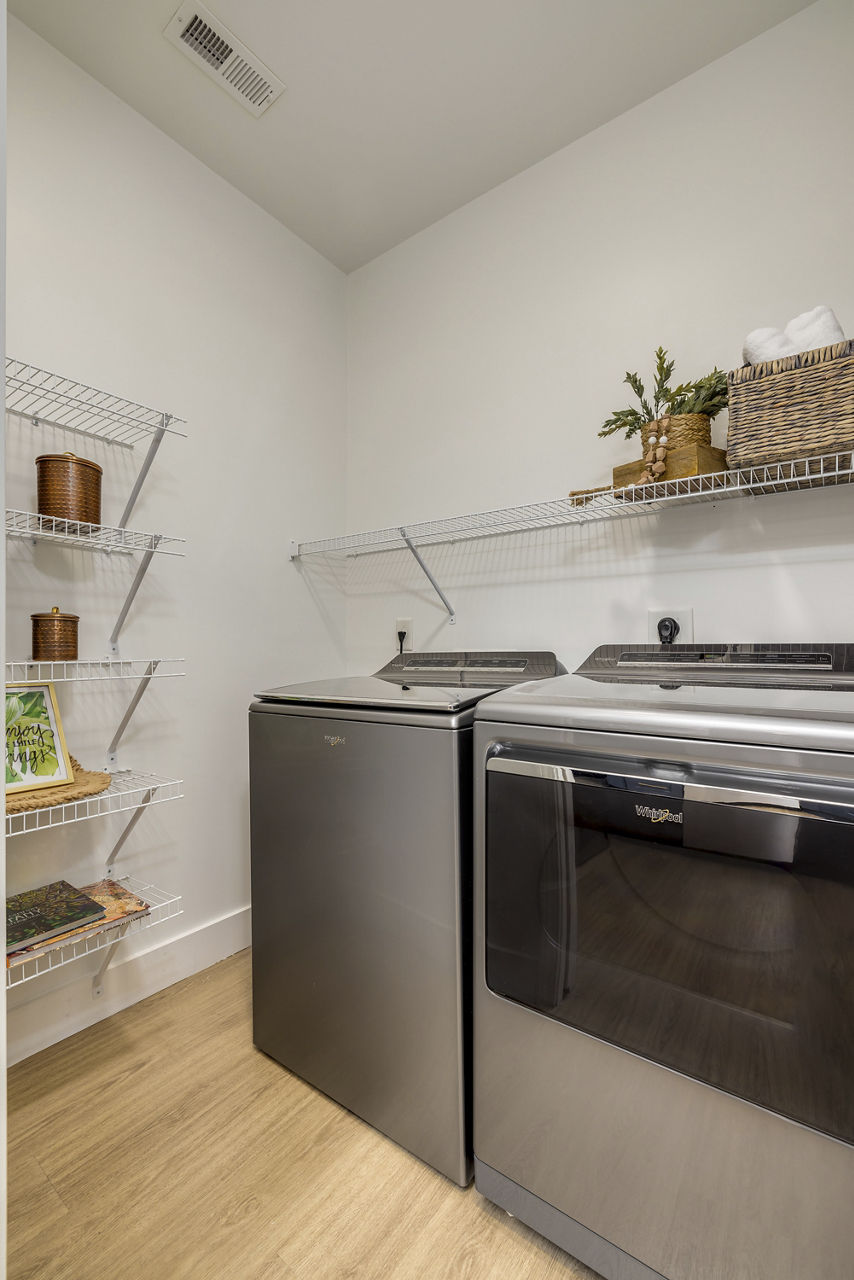 Laundry room at The Banks At Rivergate Apartments