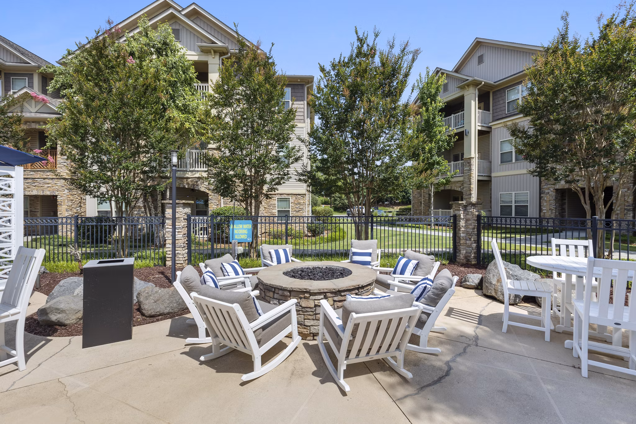 Cozy fire pit area at The Banks at Rivergate Apartments offering warm ambiance and relaxation in luxury setting